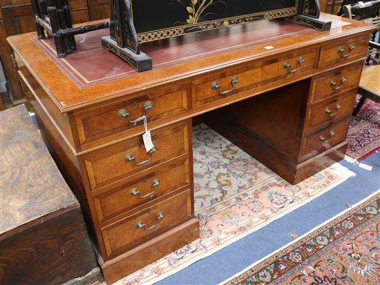 A Georgian style banded yew pedestal desk inset red/brown skiver W.152cm